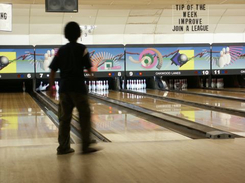 2001 Mercury Grand Marquis - A person bowls at Oakwood Lanes, with lane numbers 6 through 11 visible.