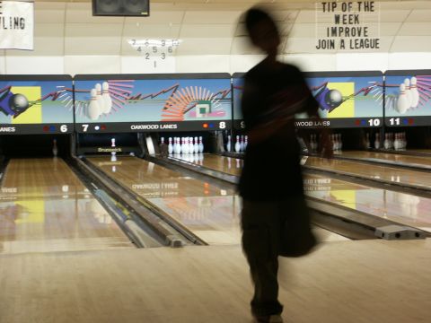 2001 Mercury Grand Marquis - Interior view of a bowling alley with multiple lanes and pins set up.