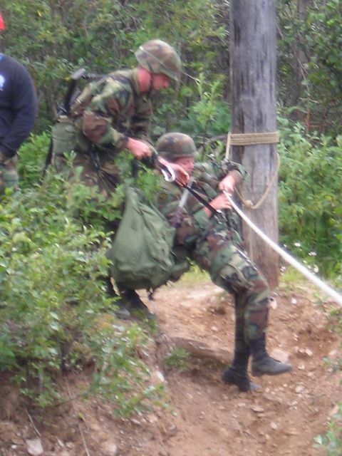 2003 Jeep TJ - Soldiers practice rappelling techniques outdoors with ropes and gear.