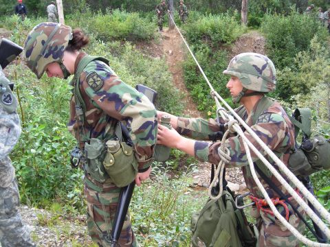 2003 Jeep TJ - Military personnel engage in rope training exercises in an outdoor environment.
