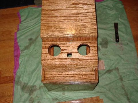 1985 Ford Bronco - Custom wooden center console build with openings for components, placed on a green cloth.
