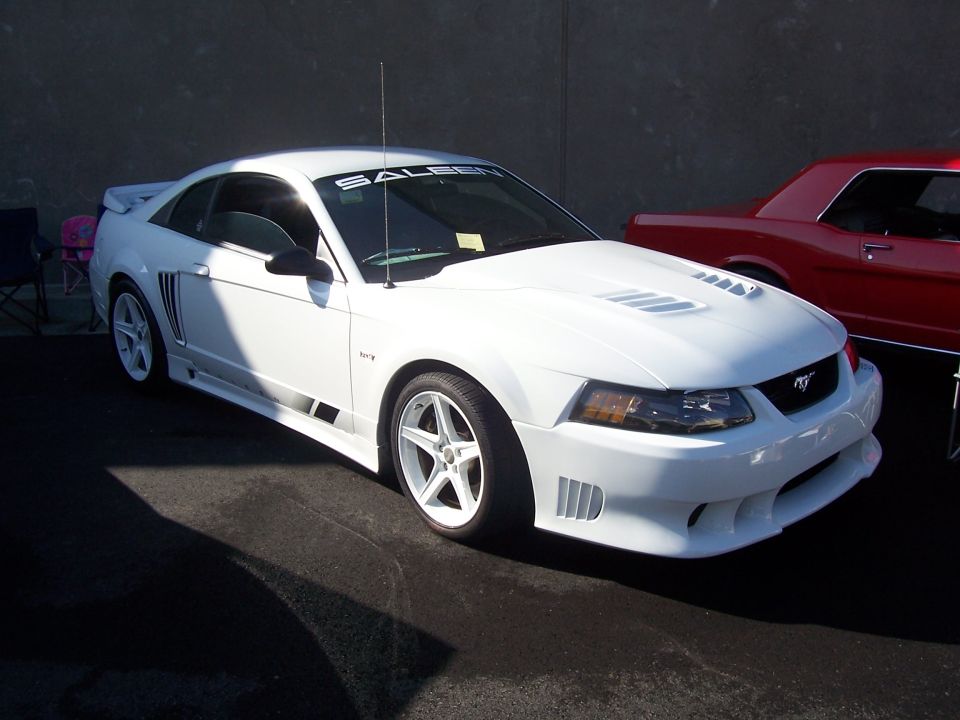 White New Edge Mustang Saleen coupe with body kit, hood vents and rear wing