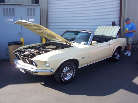 2002 Ford Mustang - Cream-colored 1969 Ford Mustang convertible displayed with its hood and trunk open.