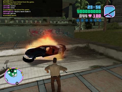 1990 Ford Probe - A digital car is engulfed in flames within a video game environment, with a character observing the scene.