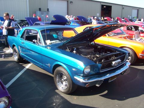 2002 Ford Mustang - Classic blue Ford Mustang coupe on display at a car show.