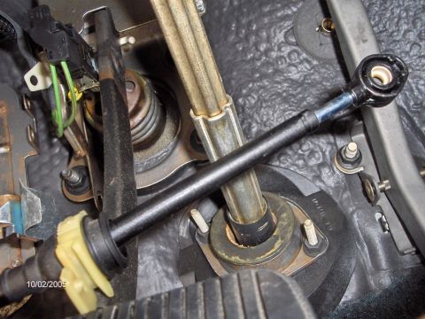 1996 Mercury Grand Marquis - The stock shifter cable removed, floating above the brake pedal awaiting re-routing