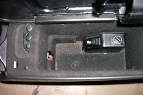 1996 Mercury Grand Marquis - The filthy storage bin, note the felt lining found on the earlier 98-02 models. Yes, I scrubbed it out of course. the hole in the front is…