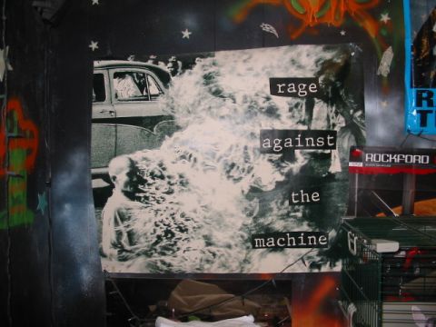 1997 Ford Crown Victoria - A poster depicting a dramatic scene with a burning man and an old car, overlaid with band text.