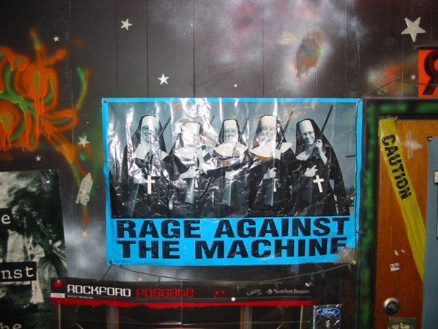 Poster of nuns holding guns with 'Rage Against the Machine' text