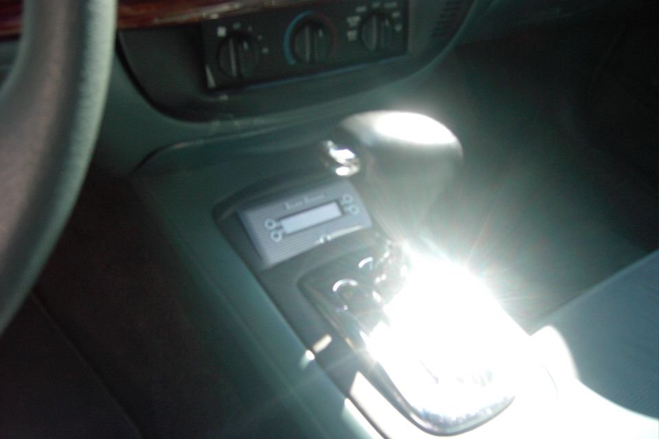 Later on:

I later relocated the scan gauge into the console, and trimmed the old ashtray/cupholder door for a perfect fit filler piece