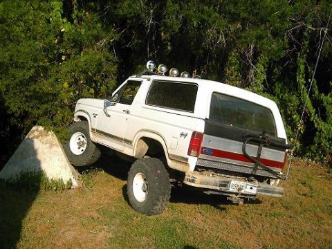 1986 Ford Bronco - This 1986 Ford Bronco is shown navigating an obstacle off-road.