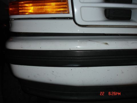 1996 Ford Bronco - This photo shows the rear corner of a white SUV, focusing on the bumper and taillight assembly. A timestamp is visible in the lower right c…