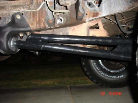 1996 Ford Bronco - Close-up of vehicle undercarriage components, including suspension and tire.