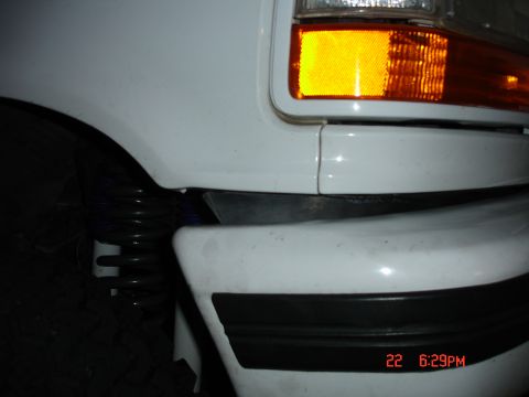 1996 Ford Bronco - Close-up of the front corner of a 1996 Ford Bronco, highlighting the turn signal and bumper detail.