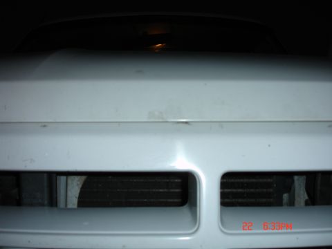 1996 Ford Bronco - Close-up of the front grille and hood of a 1996 Ford Bronco.