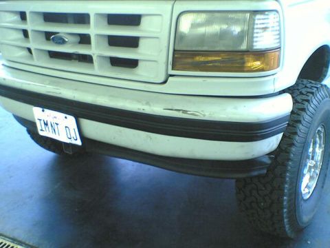 1996 Ford Bronco - Front view of a white 1996 Ford Bronco, its grille, headlights, and license plate.