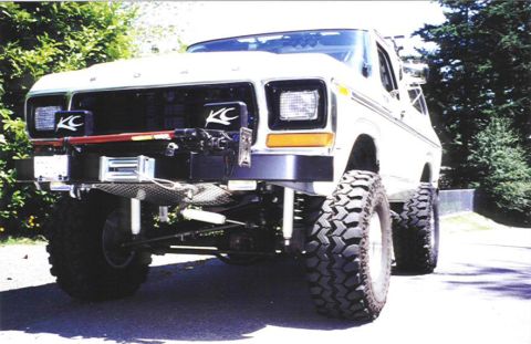 1979 Ford Bronco - This modified Ford Bronco features large off-road tires and custom front-end accessories.