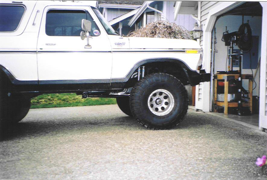 White 1979 Ford Bronco side view with lifted suspension and large tires