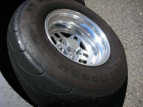 1998 Ford Crown Victoria - close-up of a Mickey Thompson ET drag slick mounted on a polished aluminum wheel.