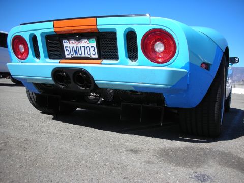 1998 Ford Crown Victoria - Rear view of a light-blue Ford GT with center dual exhaust, diffuser and a California license plate.