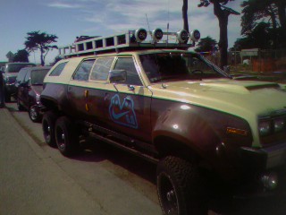 1994 Ford Bronco - This custom SUV has been modified with an extra axle and wheels, giving it a unique six-wheel drive configuration.