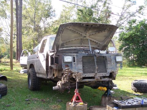1981 Ford Bronco - This truck is undergoing repairs with its front end disassembled and hood propped open.