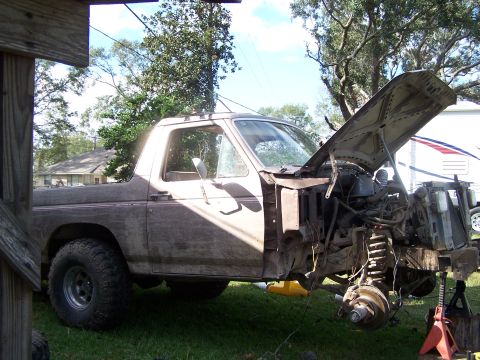 1981 Ford Bronco - This Ford Bronco's front end is dismantled, revealing the engine and suspension components.