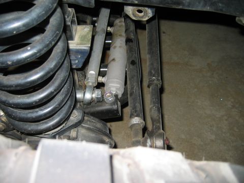 1985 Ford Bronco - This image shows the underside of a vehicle, focusing on the steering and suspension system components.