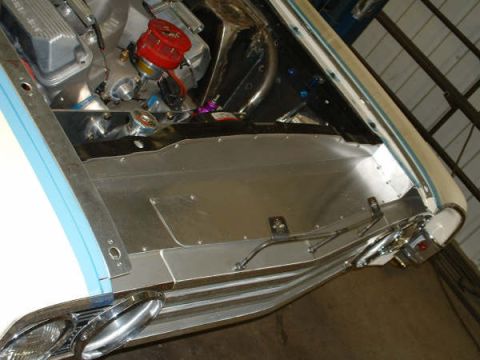 2005 Ford Mustang - Custom engine bay modifications are visible, with aluminum panels and a red distributor.