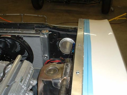 2005 Ford Mustang - Close-up view of a car's engine compartment, showing the radiator and fan assembly.