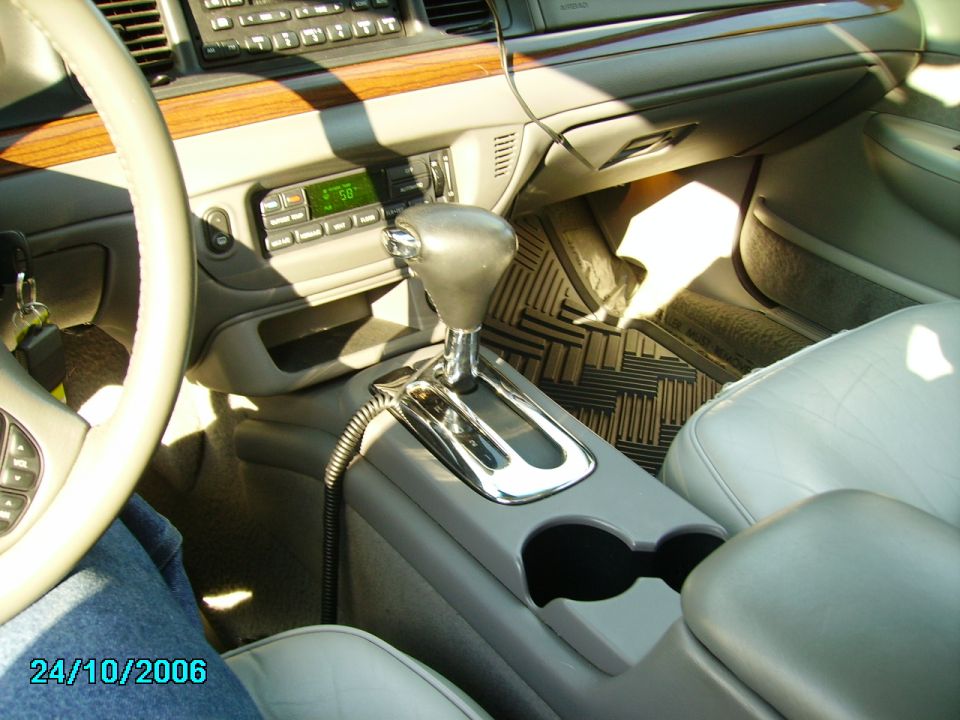 2002 Ford Crown Victoria interior with automatic shifter and wood trim