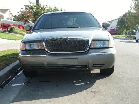 2000 Mercury Grand Marquis - Front view of a 2000 Mercury Grand Marquis parked on a street.