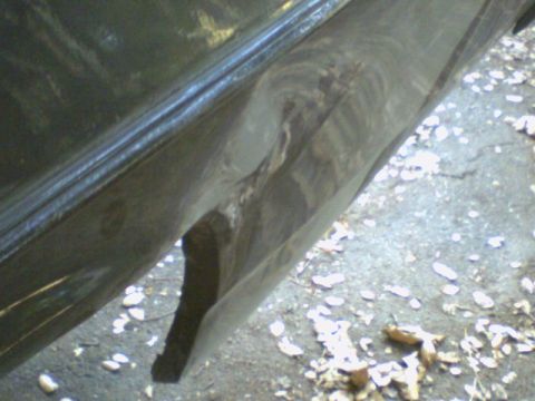 1972 Ford Ranchero - This photo shows damage to a vehicle's lower body panel, not a specific model year.