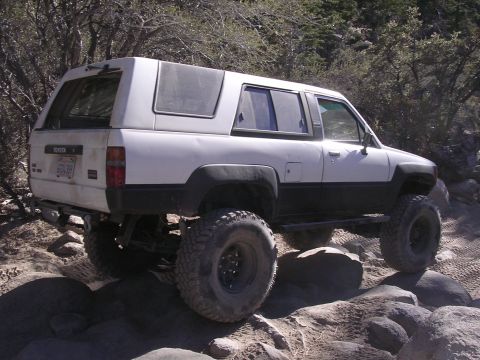 1985 Toyota 4Runner - This lifted 1985 Toyota 4Runner navigates a challenging rocky terrain, its off-road capabilities.