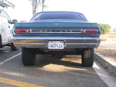 1975 Ford Ranchero - Rear view of a teal car with a chrome bumper and a California license plate.