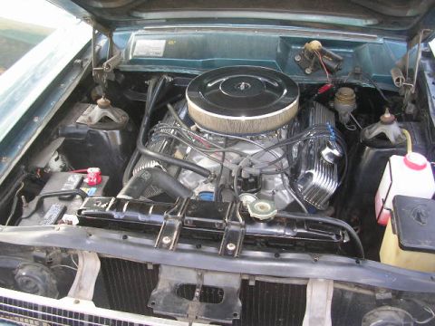 1975 Ford Ranchero - Engine bay of a 1975 Ford Ranchero showing the V8 engine and associated components.