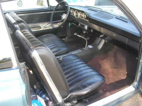 1975 Ford Ranchero - Interior view of a classic car, showing the dashboard, seats, and floor shifter.