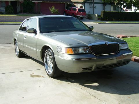 2000 Mercury Grand Marquis - A 2000 Mercury Grand Marquis is shown from the front three-quarter angle.