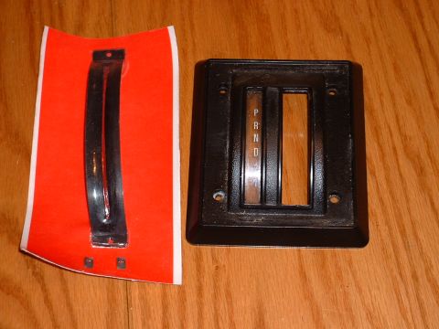 1978 Ford Mustang II - Automatic transmission shifter bezel and trim piece shown on a wooden surface.
