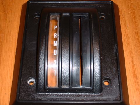 1978 Ford Mustang II - This image shows a close-up of a vehicle's automatic transmission shifter plate, displaying the gear selection options.