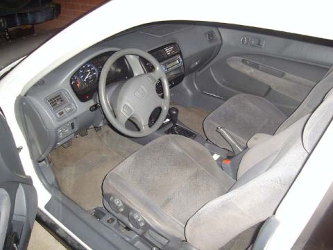 1997 Ford Probe - The interior of a Honda Civic is visible, including the driver's seat and dashboard.