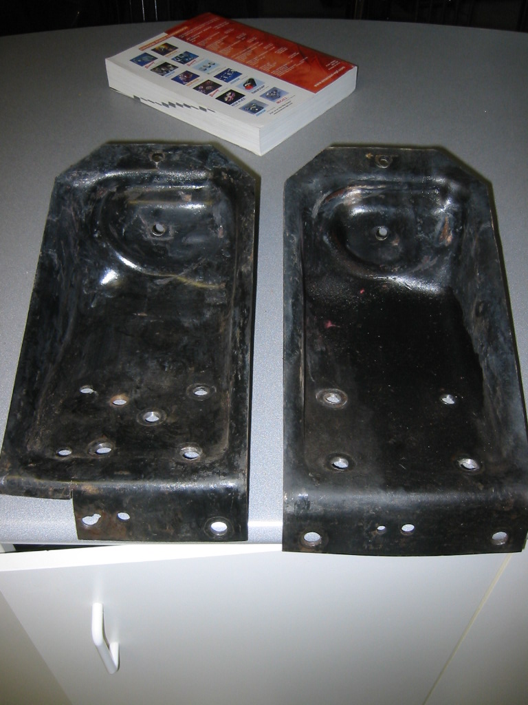 79 bronco (original) upper coil buckets. these have been installed on an 80's bronco for a SAS already so  that's why it's got the rivet notch and the extra holes already.