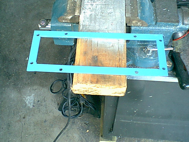I decided to make this cool adapter. it allows the new panel to mount to it and it then bolts to the stock 4 holes. I had sole file cabinet rails sitting in the shop and just chopped and welded them into a box. I then drilled the mounting holes and hit with primer and paint.
