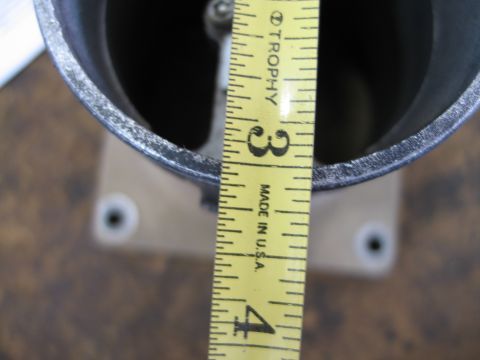 1995 Ford Bronco - A measuring tape is used to show the dimensions of a MAF sensor part.