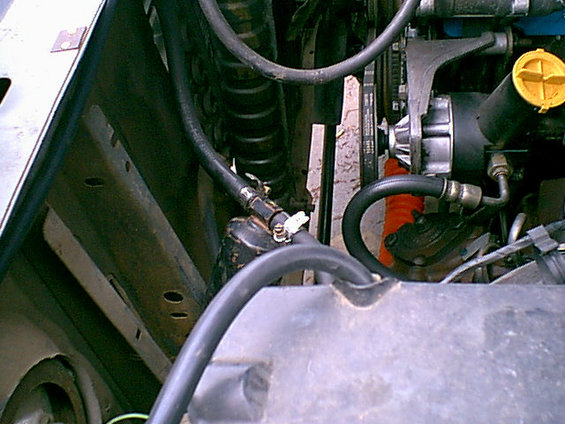 Here is the connection that failed. They put a iron pipe inside the hose and it rusted away. the hose was loose and leaked. this goes to the condenser in front of the raditor.