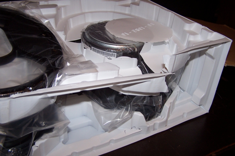 Yup, it's as bad as I feared; here's what I found under the first speaker cover...