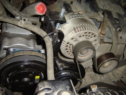 1992 Ford Bronco - Engine bay detail showing alternator, AC compressor, and serpentine belt system.