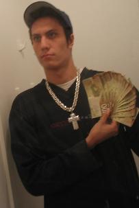 1990 Ford Probe - A man displays a fan of Canadian currency while wearing a large silver chain and a baseball cap.