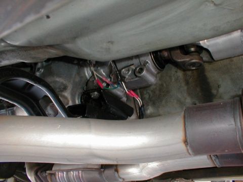 1993 Ford Thunderbird - Underside view shows the driveshaft and exhaust system components of a vehicle.