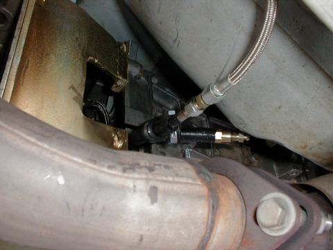 1993 Ford Thunderbird - This photo shows a clutch slave cylinder and part of the exhaust system, not a 1993 Ford Thunderbird.